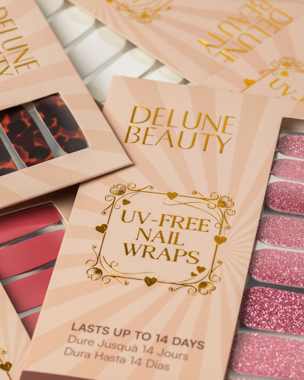 Glitter Bug (Non-UV Nail Wraps): Delune Beauty UV-free nail wrap packaging, lasts up to 14 days, with tortoiseshell, red and pink glitter wraps