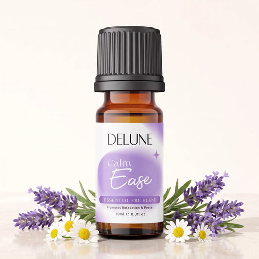 Delune Calm Ease Essential Oil Blend 10ml amber glass bottle with fresh lavender and chamomile flowers